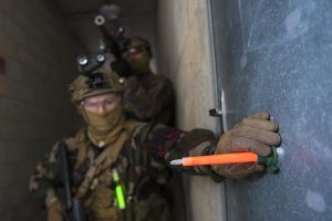 Marking buildings with glow sticks attached to a magnetic base