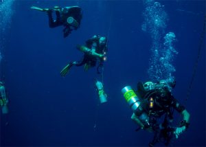 Divers moving with Cyalume sticks for personal identification