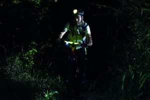 mountain biking at night with fluorescent markers